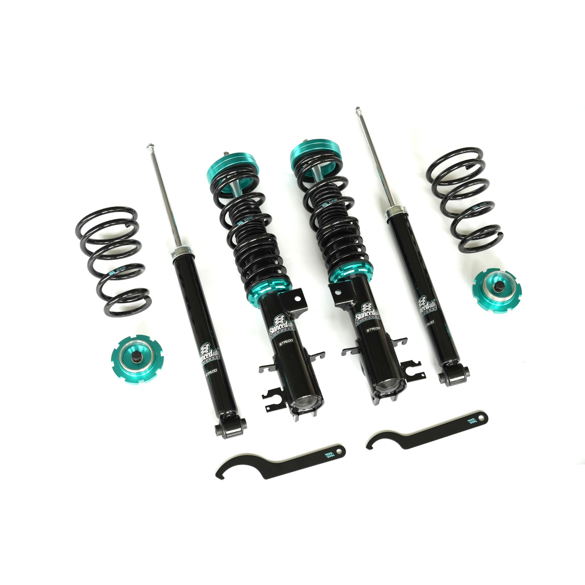 Full view of Stanced UK STA100 coilover kit – front and rear suspension components with tools, finished in black and teal