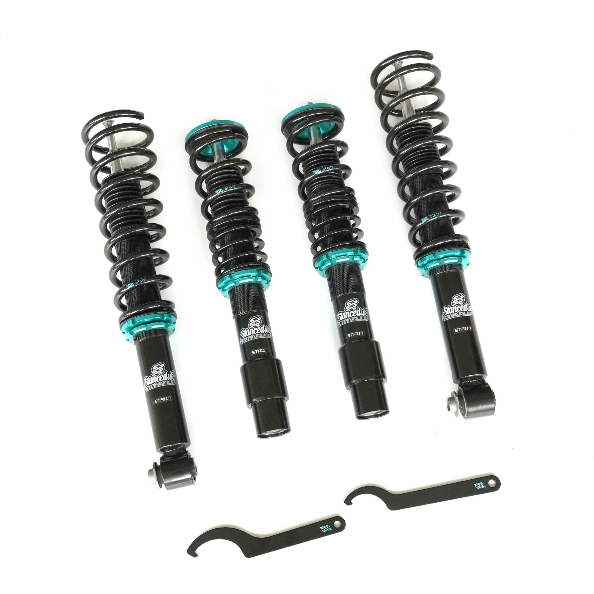 Stanced UK suspension kit with springs and shocks on a white background