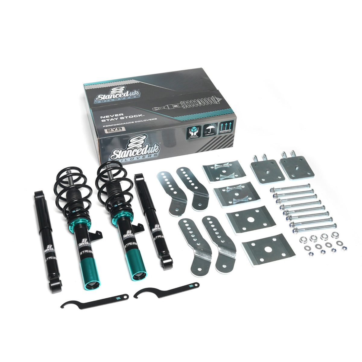Full Stanced UK coilover kit for VW Caddy 2K Mk3 and Mk4, showing teal front struts, rear dampers, springs, adjustable brackets, mounting hardware and branded retail box