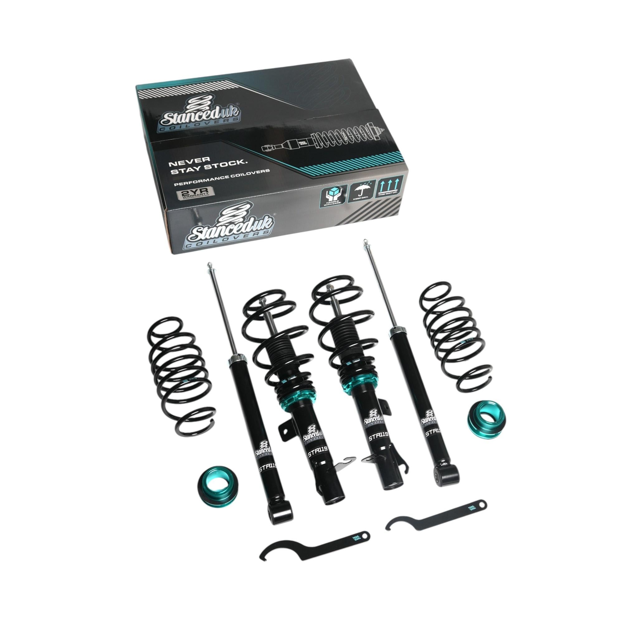  STA119 Stanced UK Coilover Kit displayed with retail packaging, coil springs, and dampers.